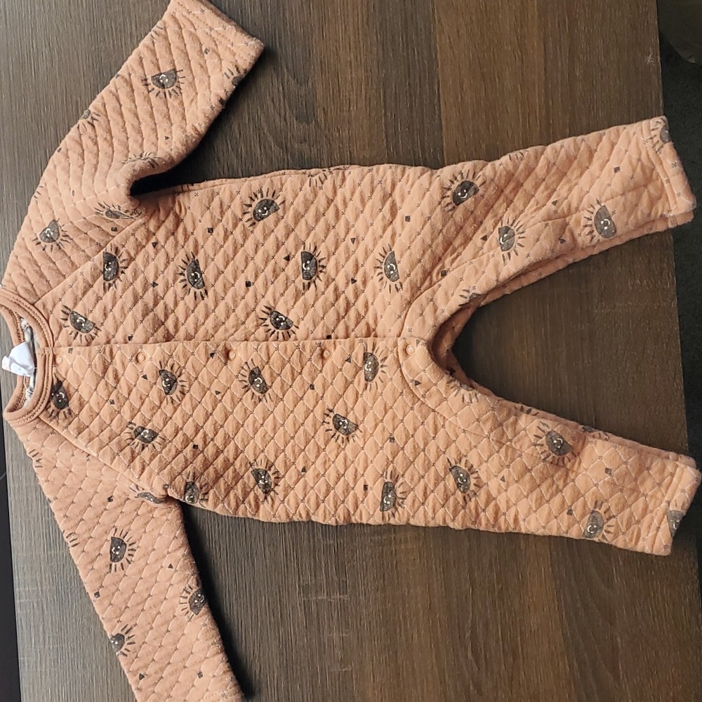 Quilted jumpsuit in a neutral style